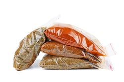 Four types of spicies in plastic packet isolated on a white background