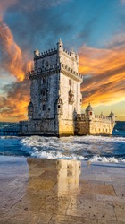 Vertical composition of sunset over Belem tower with reflection