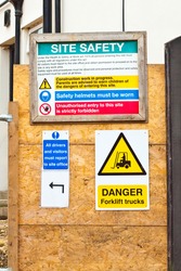 Safety notices at a construction site in the UK