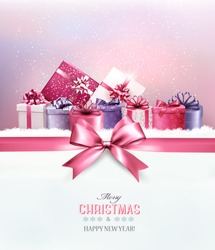 Merry Christmas card with a ribbon and gift boxes. Vector. 
