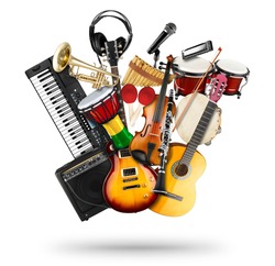 stack pile collage of various musical instruments. Electric guitar violin piano keyboard bongo drums tamburin harmonica trumpet. Brass percussion studio music concept isolated on white background