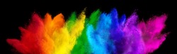 colorful rainbow holi paint color powder explosion isolated on dark black wide panorama background. peace rgb beautiful party concept
