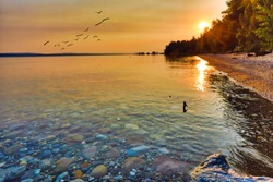 Enjoy the view of Lake Michigan during sunrise and sunset.  This view is between Petoskey and Charlevoix Michigan.