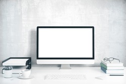 Blank screen on the desktop computer with books and cup of coffee, mock up 3D Render