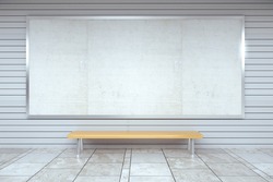 Blank billboard on the wall and wooden bench in empty hall, mock up