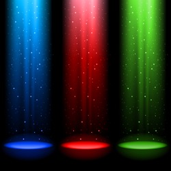 Three RGB shafts of light shines a spotlight into the black