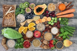 Vegan high dietary fibre and immune boosting health food  with fruit, vegetables, whole wheat pasta, legumes, cereals, nuts and seeds with foods high in omega 3, antioxidants, anthocyanins, vitamins.