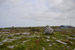 The Burren is a region of County Clare in the southwest of Ireland. the landscape is made of glacial-era limestone, with cliffs and caves, fossils, rock formations