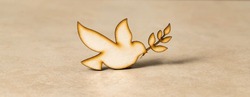 Peace dove symbol, on a similar color surface.