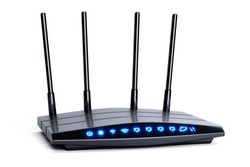 3d modern wireless wi-fi black router with four antennas and blue indicators isolated on white. High speed internet connection, firewall network and telecommunication technology concept. 2,4 and 5 ghz