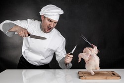 Angry cook fighting with knifes. Raw chicken attack