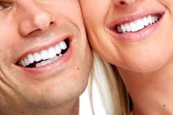 Beautiful woman and man smile. Dental health background.