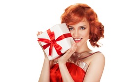 Portrait of smiling red hair woman holding gift box. Isolated on white.