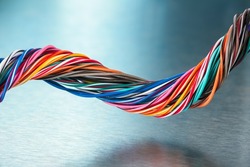 Multicolored electric cable wire on metallic background