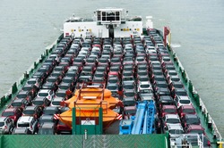 Boat carries a lot of cars to market