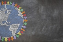 A hand drawn chalkboard shows multi-ratial people holding hands around the world to show care for the earth, peace, and unity.  Shown off centered for copy-space.