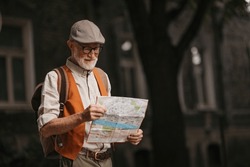 Senior tourist exploring a new city, exploring interesting places