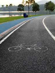 Bicycle lane and a jogging path in an outdoor recreational park.