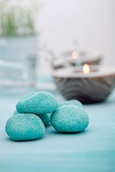 Spa and wellness setting with flowers, candles and towel. Blue dayspa nature set with copyspace