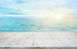 Wooden table. Summer background. Ocean with sunset. Wood planks for your montage