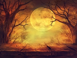 Halloween background. Spooky forest with full moon and wooden table
