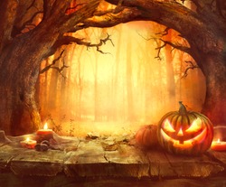 Halloween pumpkin. Scary pumpkin on table. Halloween background. Pumpkins in forest