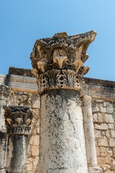 Reconstruction of the ruins of the White Synagogue where Jesus preached at Capernaum, Kfar Nahum, Capharnaum, next to the Sea of Galilee in Israel. Capitals of the synagogue.
