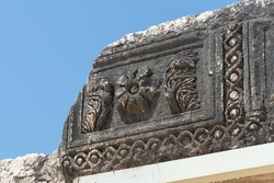 Reconstruction of the ruins of the White Synagogue where Jesus preached at Capernaum, Kfar Nahum, Capharnaum, next to the Sea of Galilee in Israel. Close up details of carved features.
