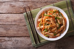 Chow Mein: fried noodles with chicken and vegetables. horizontal view from above 