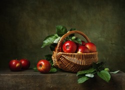 Still life with apples in a basket