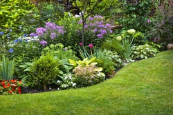 Lush landscaped garden with flowerbed and colorful plants