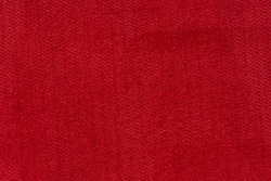 Closeup detail of red fabric texture background.