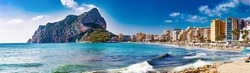 Scenic Spain beach sunset.Rock of Penon by Ifach. Mediterranean coast landscape in the city of Calpe. Coastal city located in the Valencian Community, Alicante, Spain.