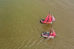 Aerial top shot from traditional dutch wooden boats at the IJsselmeer near the harbor from Laaxum in Friesland the Netherlands 