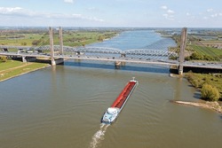 Aerial from a freighter on the river Waal at the Martinus Nijhof bridge near Zaltbommel in the Netherlands