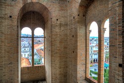 View of downtown Cuenca, Ecuador, from inside one of the towers of the Cuenca Cathedral, on a sunny morning.