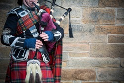 Playing the bagpipes on streets of Edinburgh