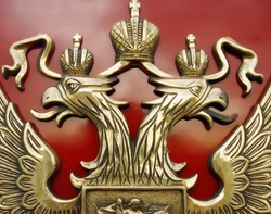 The bronze Russian railway mark on a red background