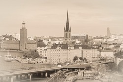 Stockholm city skyline with City Hall (Stadshuset), Central Bridge (Centralbron) and Old Town (Gamla Stan). Retro faded Stockholm postcard - vintage style sepia tone.