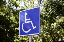 Vertical sign for disabled people, detail of information sign, facilities for people