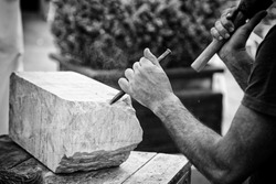 Carving stone, craftsman shaping stone, art and crafts