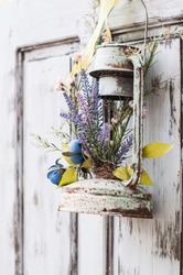 Vintage wedding decorative lantern with flowers on the door