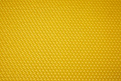 Texture of honeycomb. Bright yellow background. Honey cells. Top view. Honey cell pattern, mosaic background, isolated on white