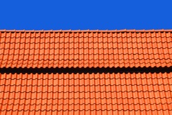 Red tiles roof and blue sky background