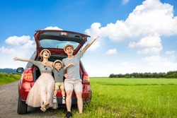 Happy family on  road trip in the car. having fun with summer vacation