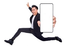 Happy young man running and showing big Smartphone With Blank White Screen