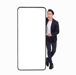 Young man standing and showing big Smartphone With Blank White Screen