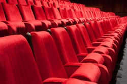 Empty red seats for cinema, theater, conference or concert