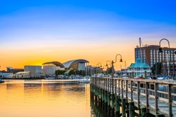 View of Hampton Virginia downtown waterfront district seen at sunset under colorful sky