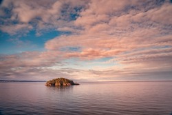 beautiful Seascape at sunrise seen from Deception Pass in Washington State with water and rocks